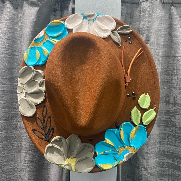 Bought two hats from an artist never wore this one! Hand painted hat